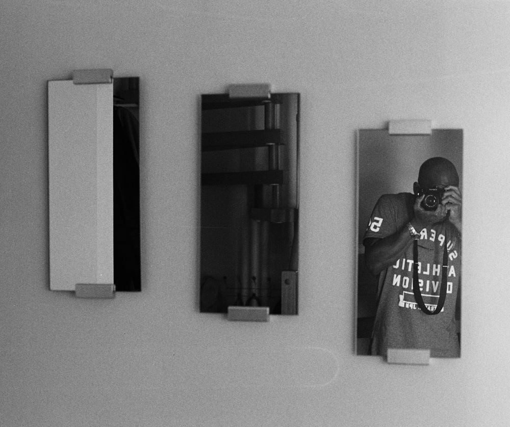 C. Duayne Pearson monochrome mirror self-portrait with Canon AE-1 Program 35mm camera