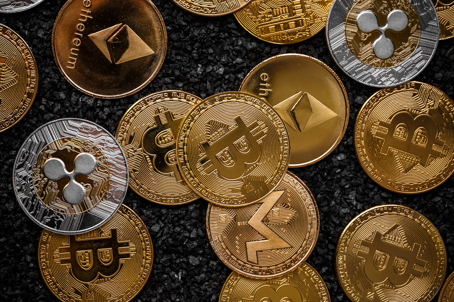 Physical Bitcoin, Ethereum & XRP coins in gold and silver