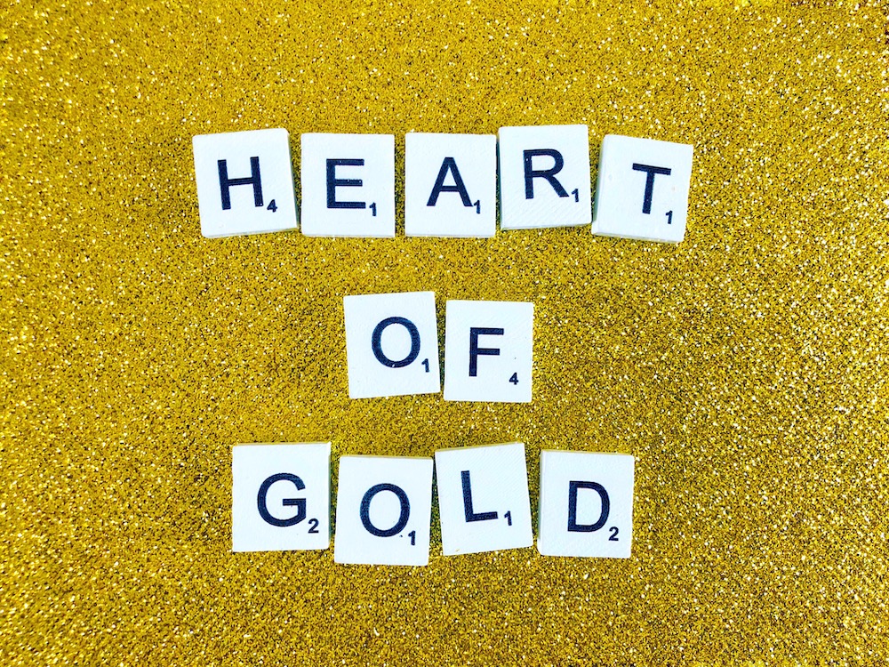 Gold background with Heart of Gold spelled out in Scrabble letters